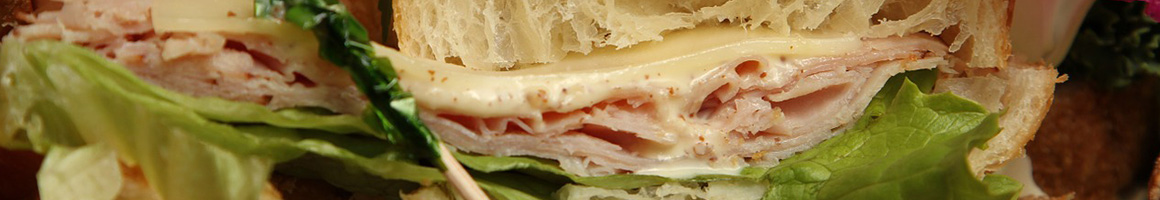 Eating Deli Sandwich at Joe's Deli restaurant in Federal Way, WA.